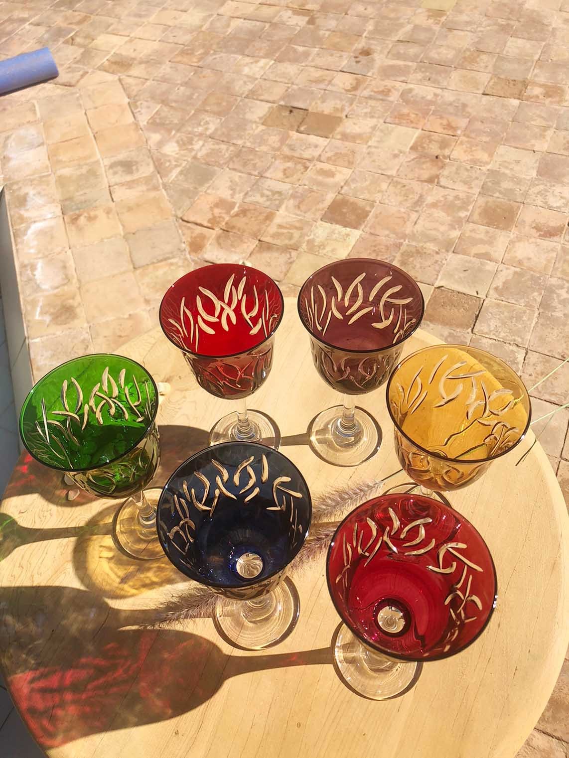 https://www.scentsandfeel.com/wp-content/uploads/2023/01/assorted-colors-moroccan-WINE-GLASSES-CARVED-LEAVES.jpg